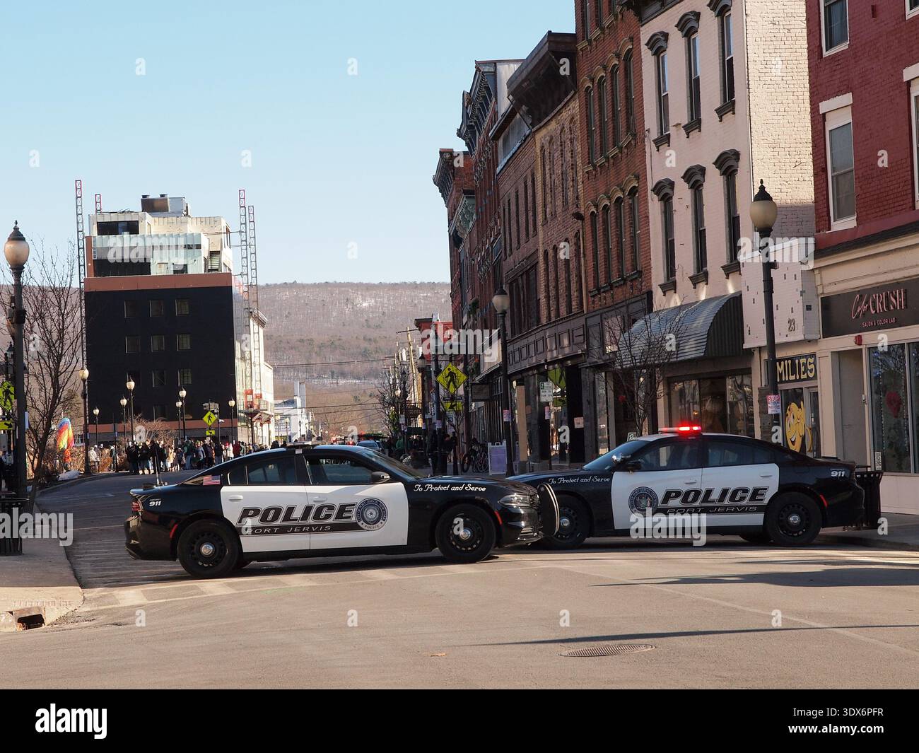 Two police cars blocking a street hi-res stock photography and images ...