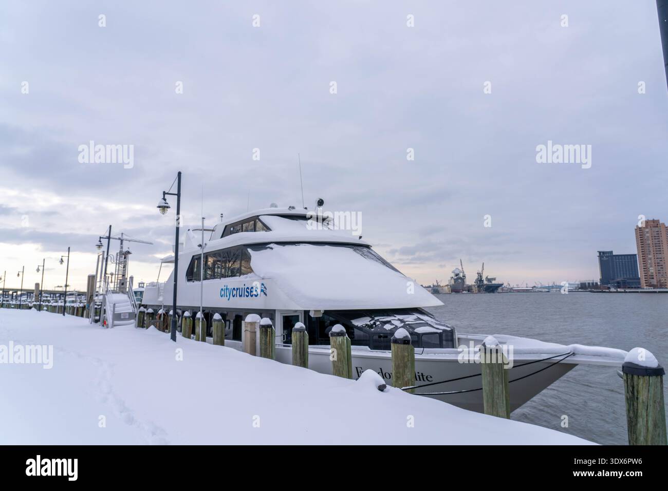 Norfolk Virginia - February 20 2025:  A City Cruise Boat After a Snowstorm in Town Point Park Norfolk Virginia Stock Photo