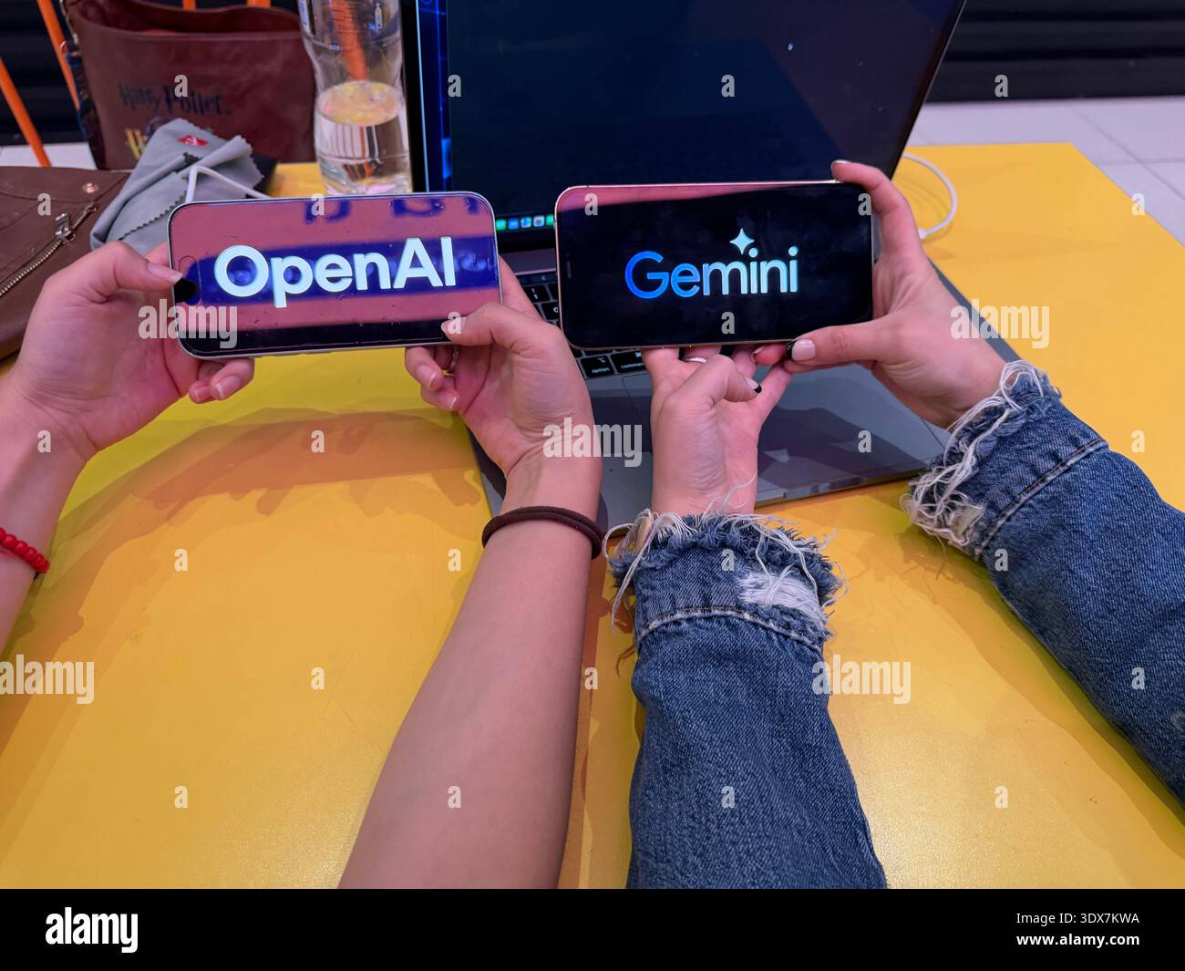 OpenAI and Google Gemini logos on digital screens. This editorial image ...