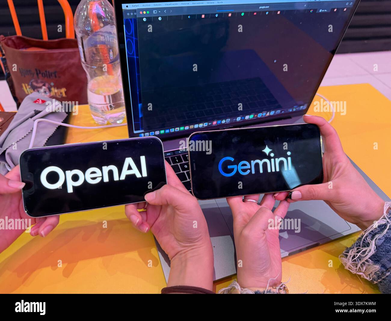 OpenAI and Google Gemini logos on digital screens. This editorial image ...