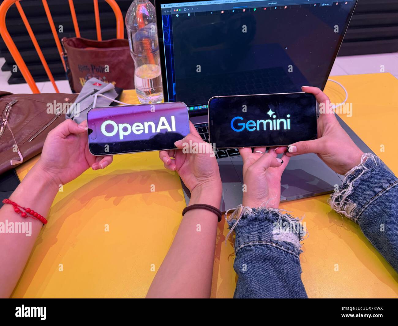 OpenAI and Google Gemini logos on digital screens. This editorial image ...