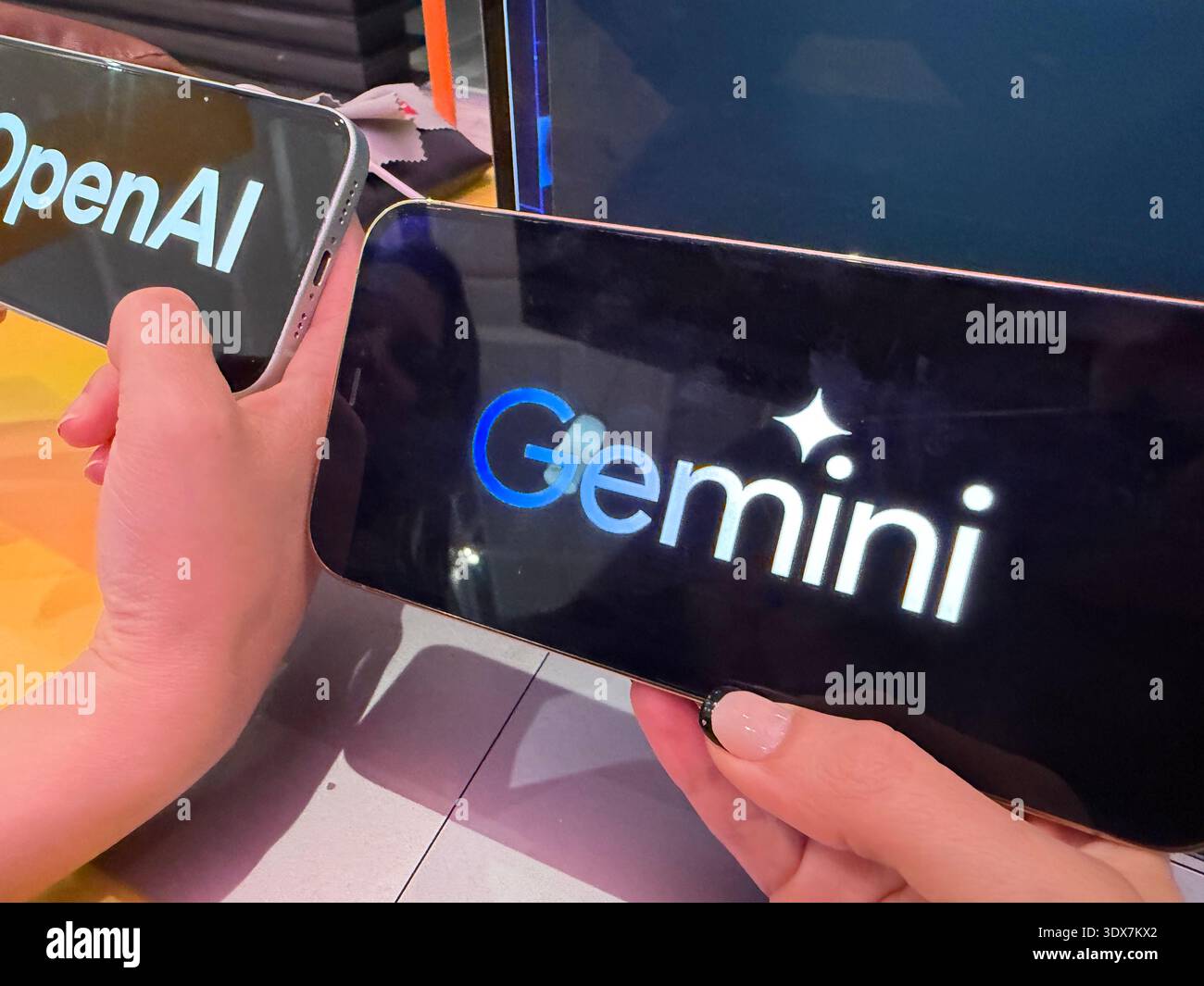 OpenAI and Google Gemini logos on digital screens. This editorial image ...