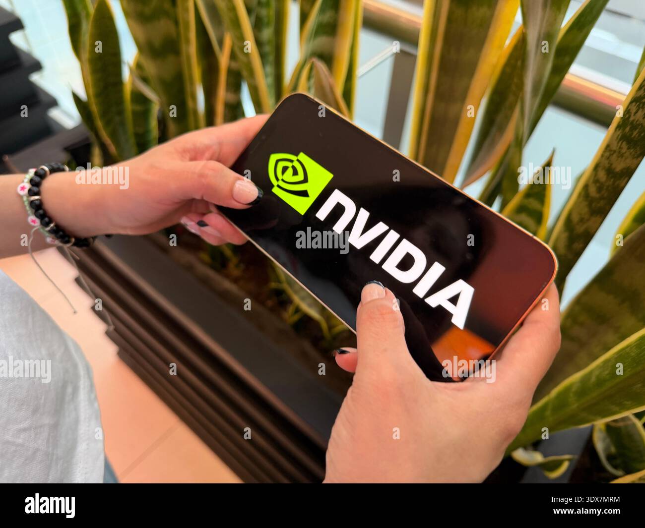 Close-up of the NVIDIA logo on a high-end graphics card. This editorial ...