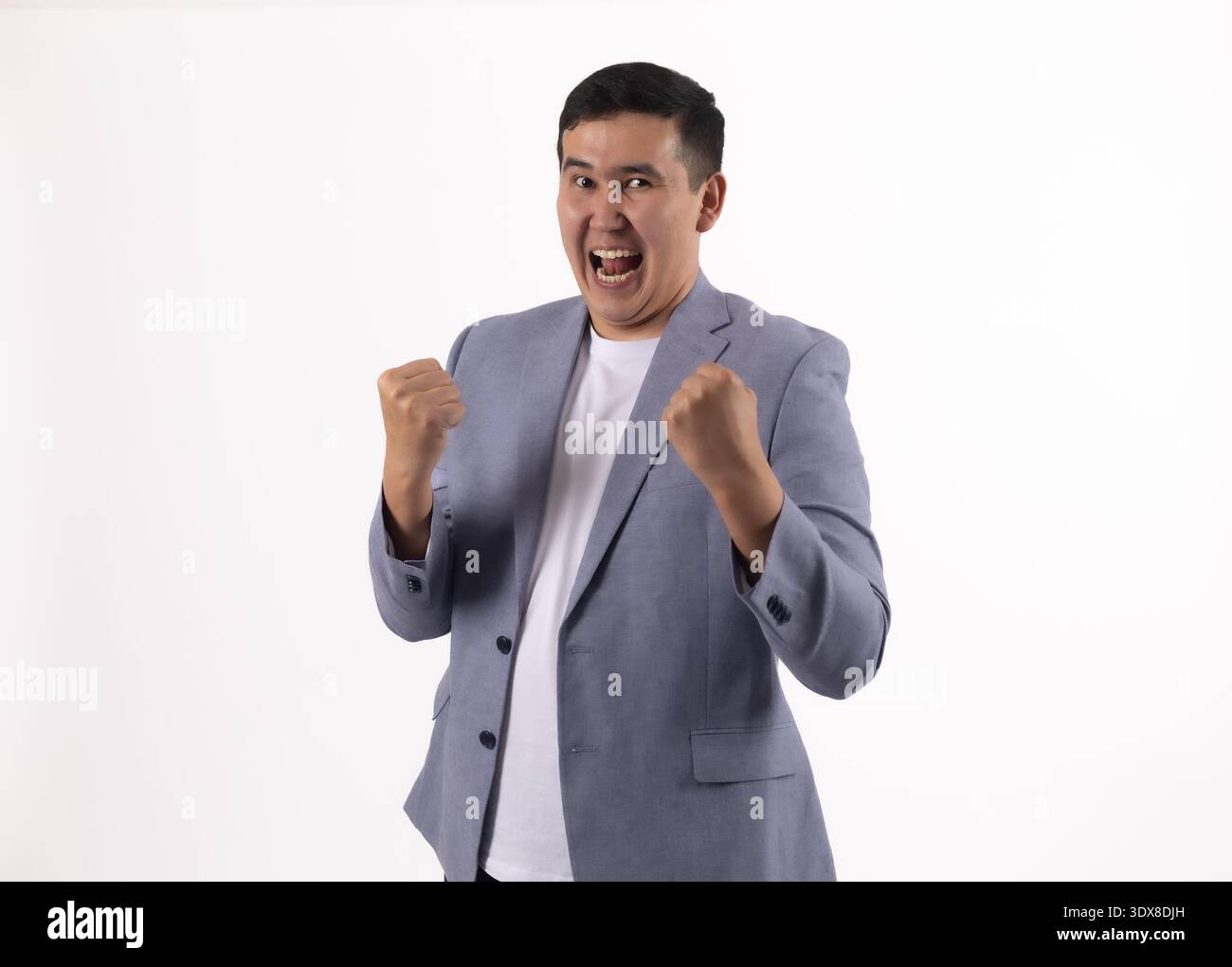 Excited businessman shouting with joy on white background Stock Photo