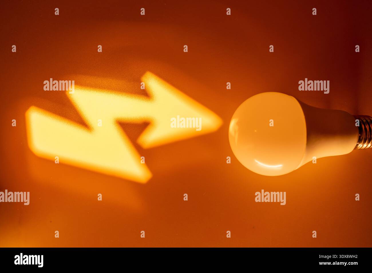 Glowing yellow arrows and sphere on dark background Stock Photo