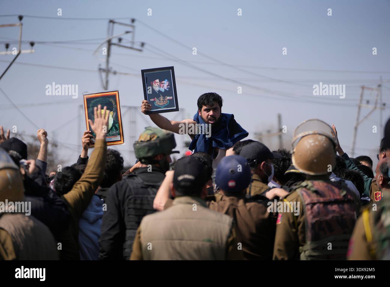 A Shiite Muslim man shout slogans as police stop them during a protest ...