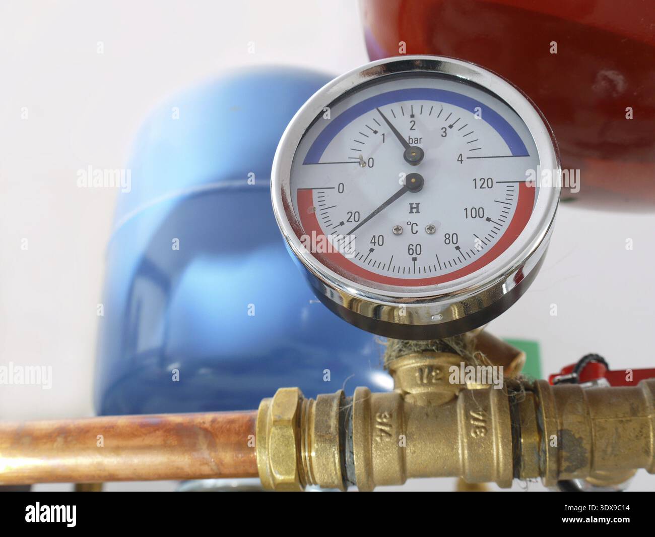 Temperature and pressure gauge mounted on boiler pipes Stock Photo - Alamy