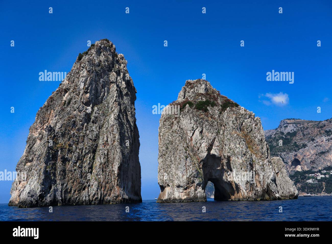 two of the most famous rocks on the island of Capri, the Faraglioni ...