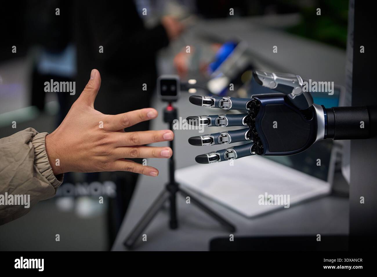 An assistant challenges the Dexterous bionic hand to a game of rock ...