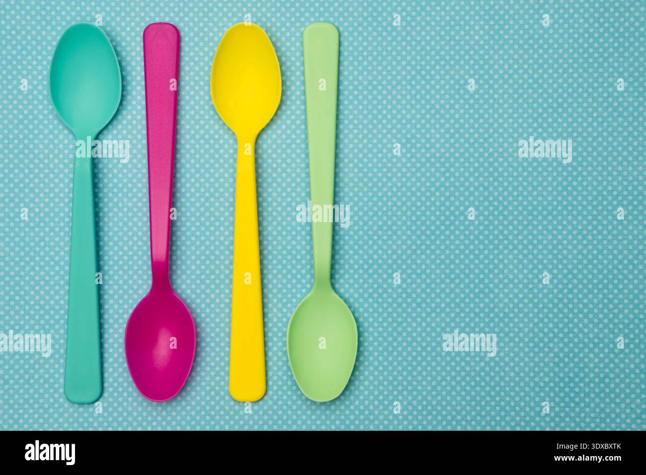 Multi Colored Spoons on a Spring Background Stock Photo