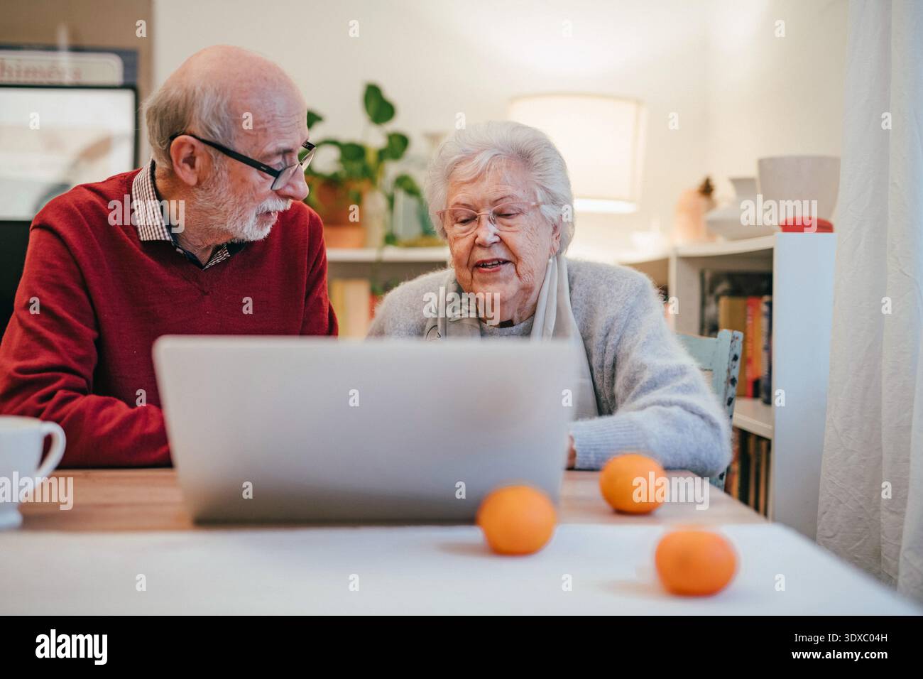 Old people having problem with laptop. Stock Photo