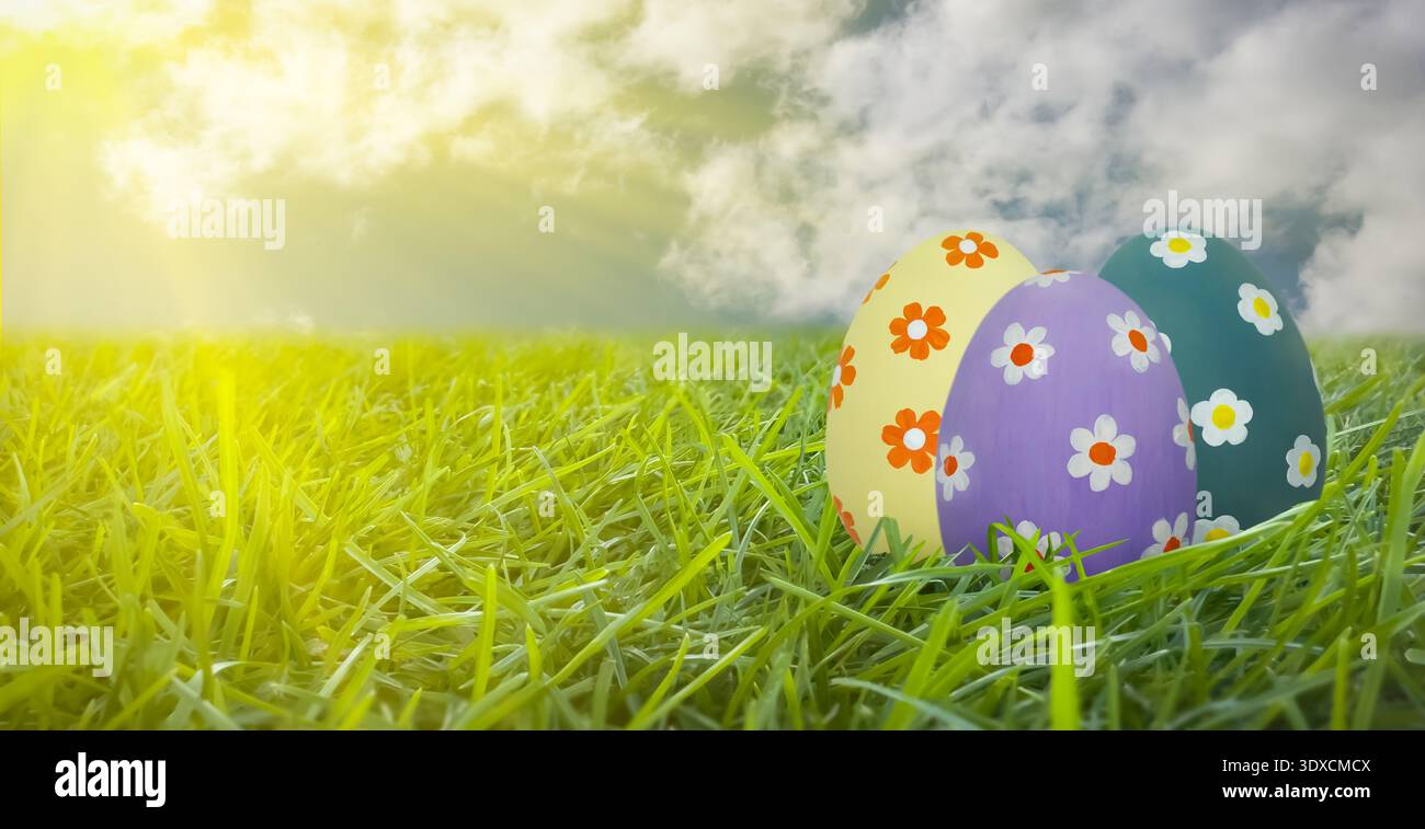 Easter eggs with floral patterns in green spring grass Stock Photo