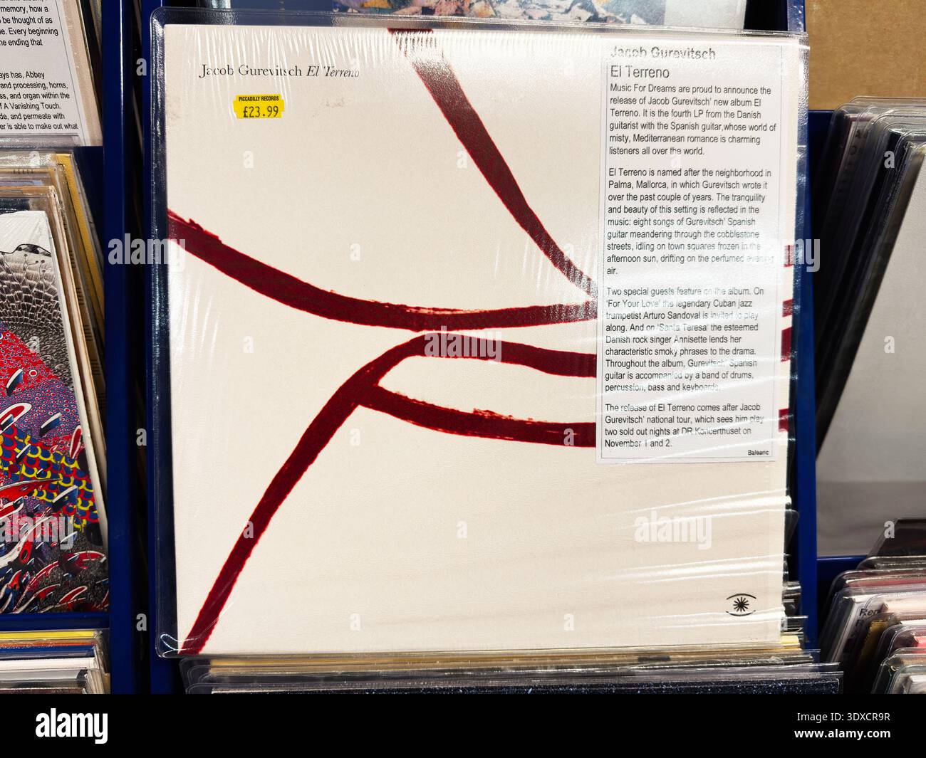 Manchester, UK - February 22, 2026: Minimal vinyl album cover for Jacob Gurevitsch's El Terreno featuring bold red abstract lines and Spanish guitar j Stock Photo