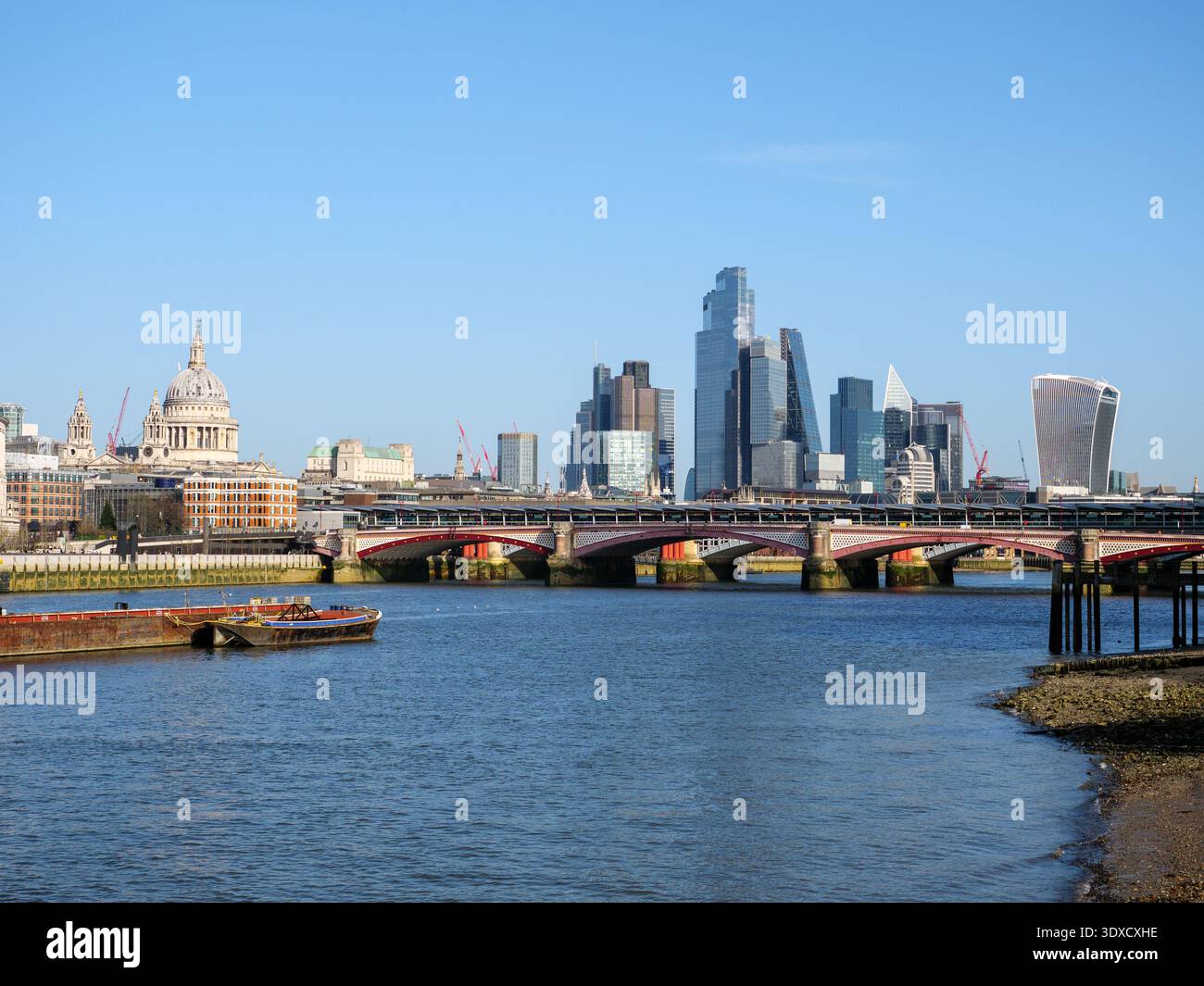 Cityscape view of the river Thames and city skyline of modern skyscraper office buildings of the financial district and Blackfriars Bridge, London, UK Stock Photo