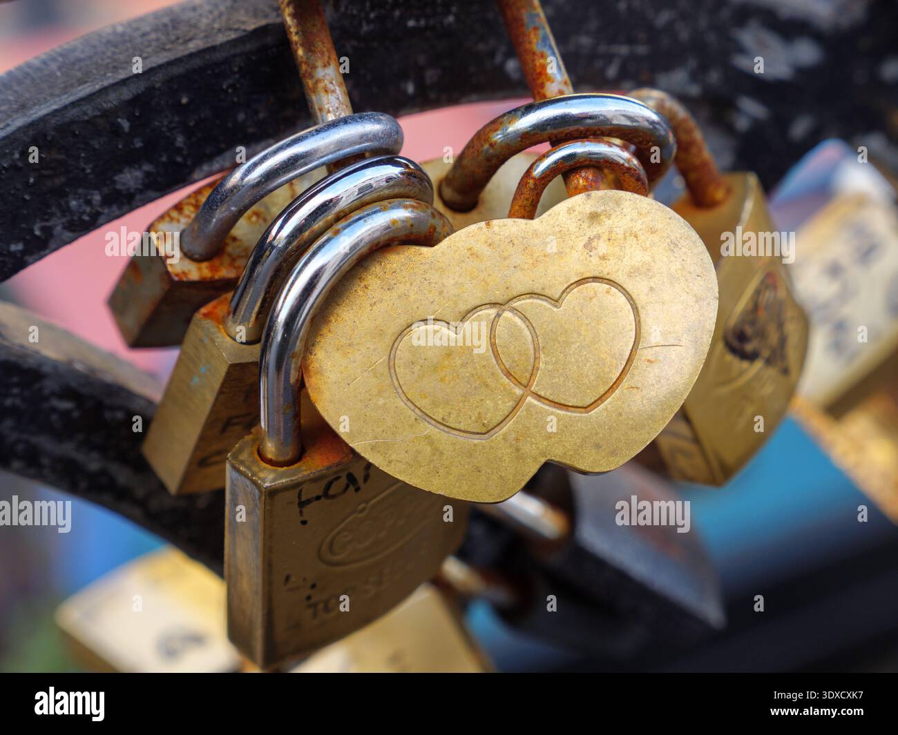Romantic entwined hearts on love padlocks attached to metal railings, Camden Town, London, UK Stock Photo
