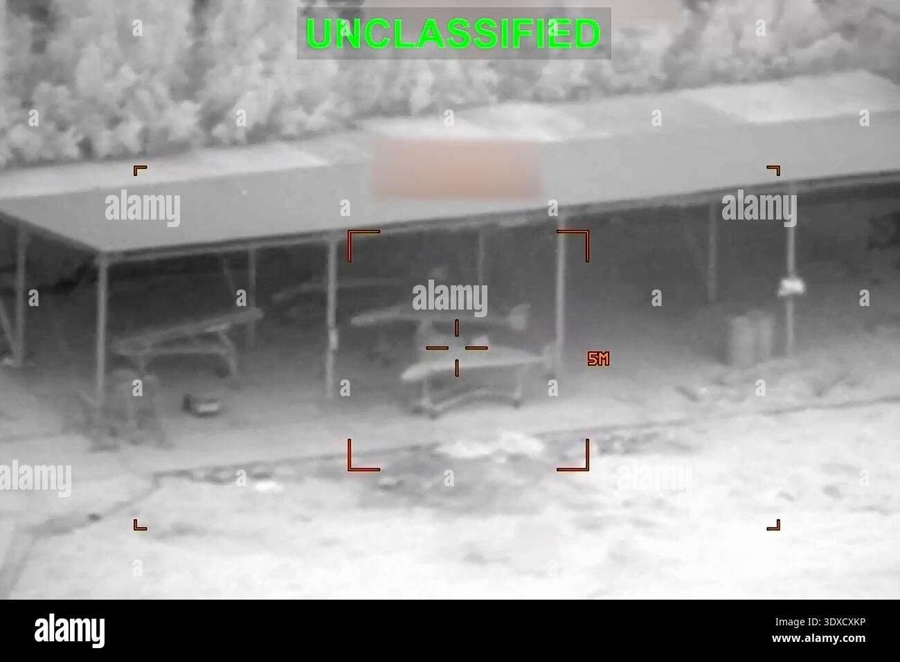 Partially Redacted This partially redacted image from video provided by U.S. Central ...