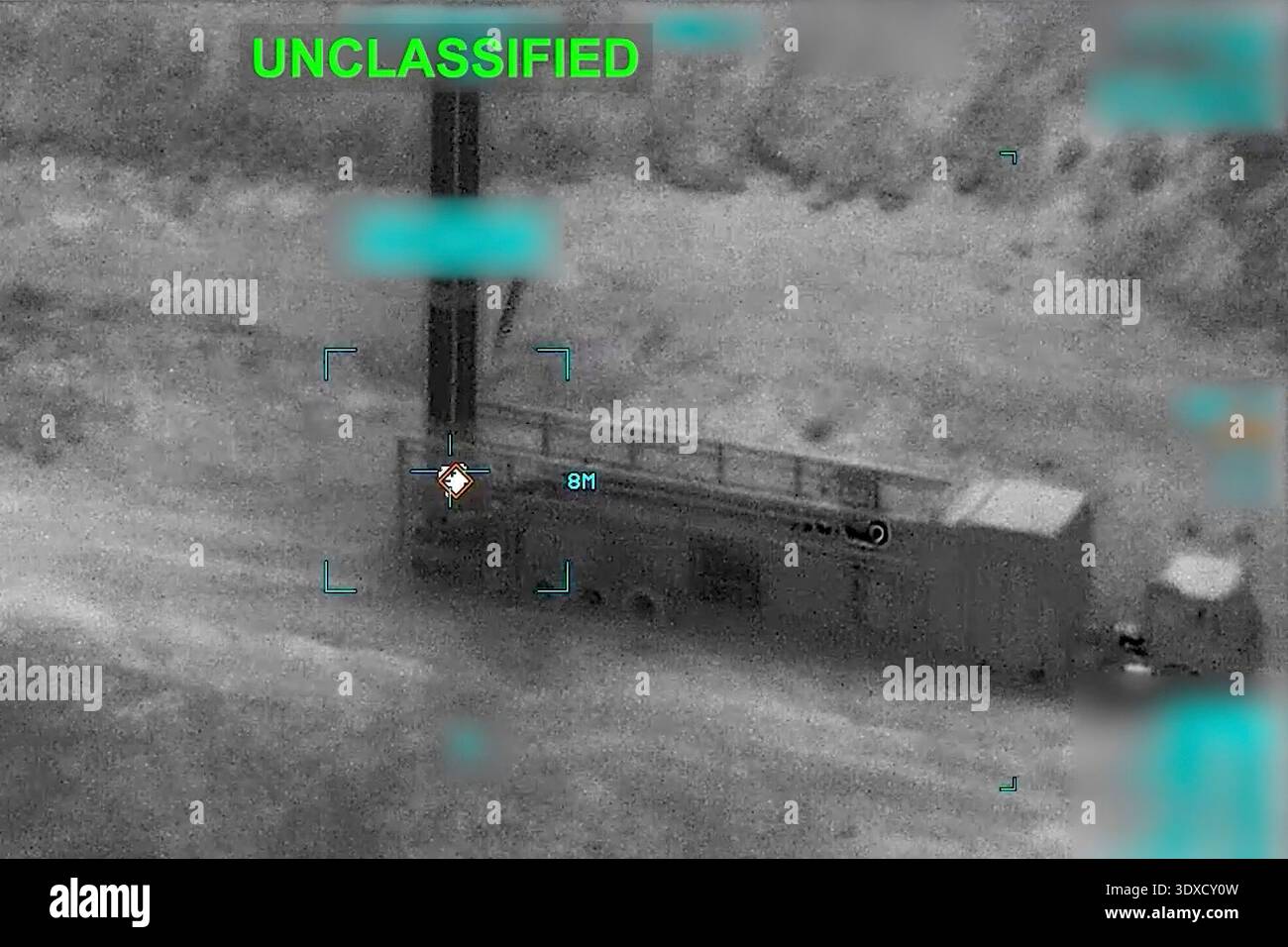 Partially Redacted This partially redacted image from video provided by U.S. Central ...