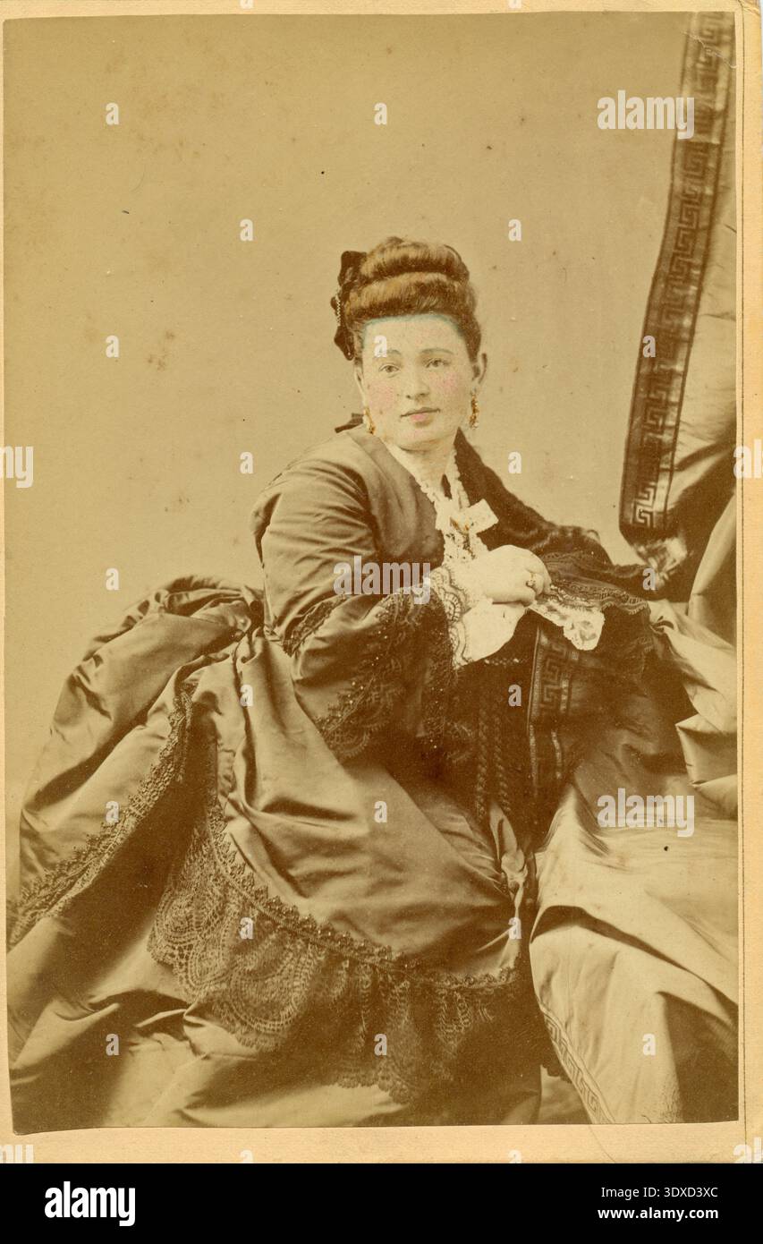 Seated woman in skirt hi-res stock photography and images - Alamy