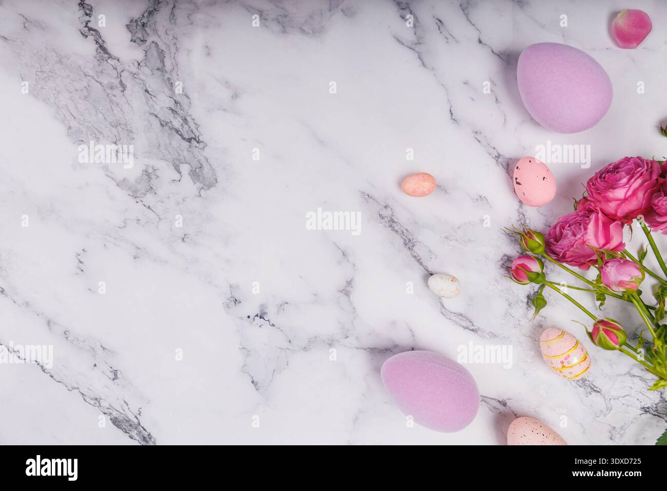 Easter Composition with Decorative Eggs and Pink Flowers Stock Photo