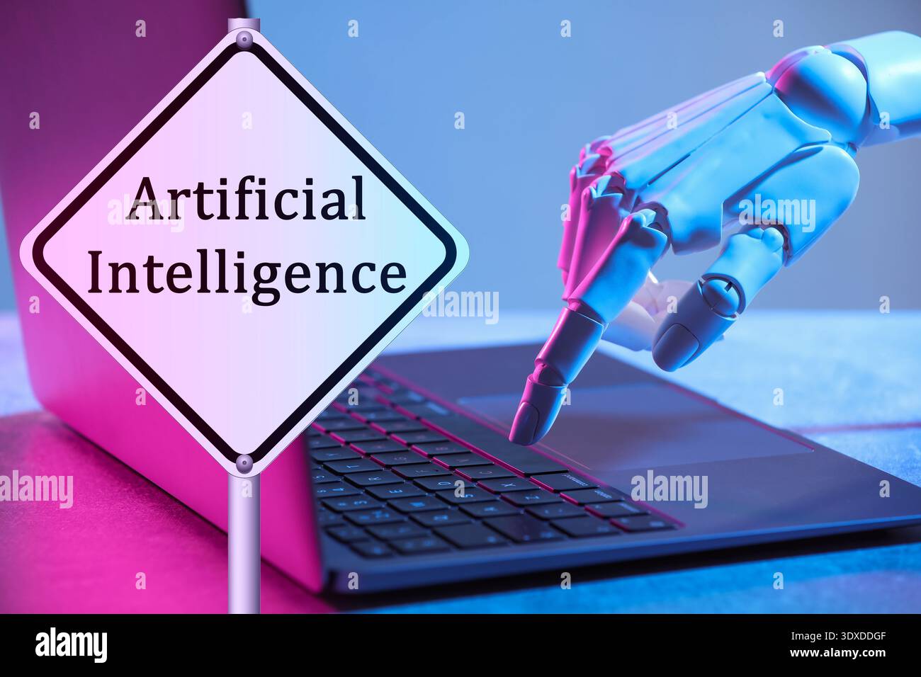 Robot using laptop. Sign with text Artificial Intelligence Stock Photo