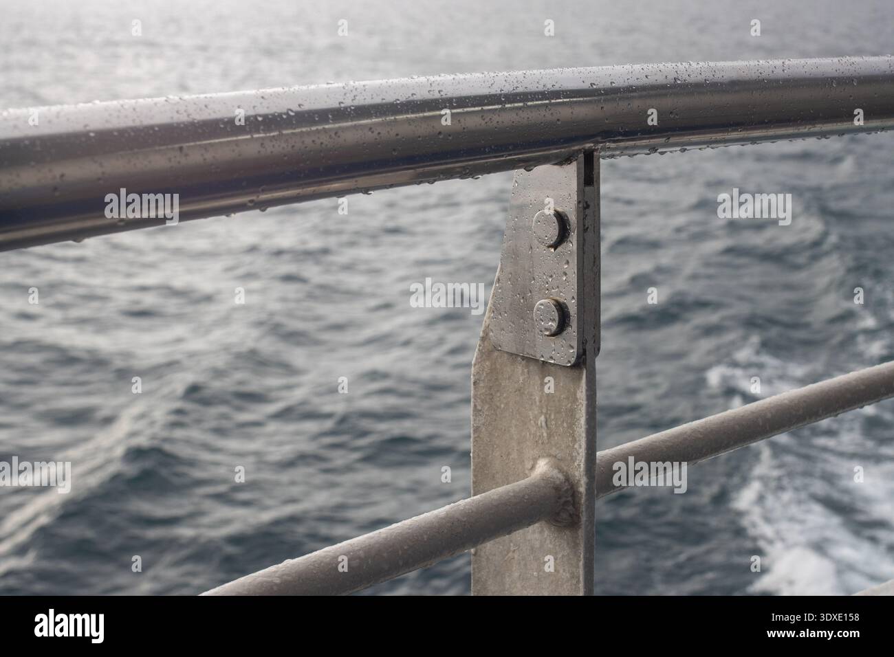 Storm Rails In Ship Safety Railing and Metal Guard on Ship Deck Above the Deep Blue Sea ...