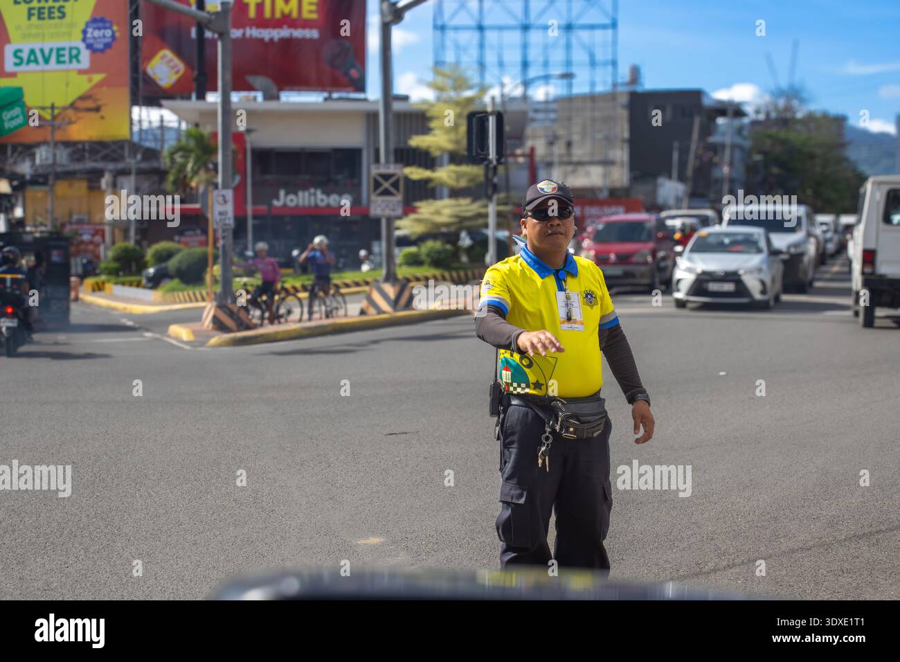 CCTO Traffic Officer Directing Vehicles on a Busy Street in Cebu City ...