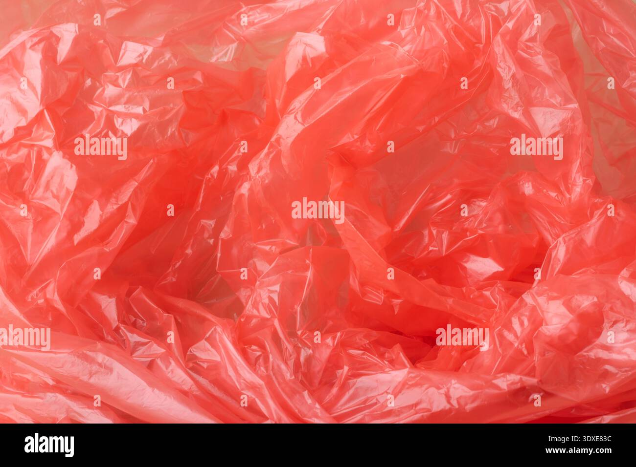 Crumpled blue plastic creating an abstract texture background Stock Photo