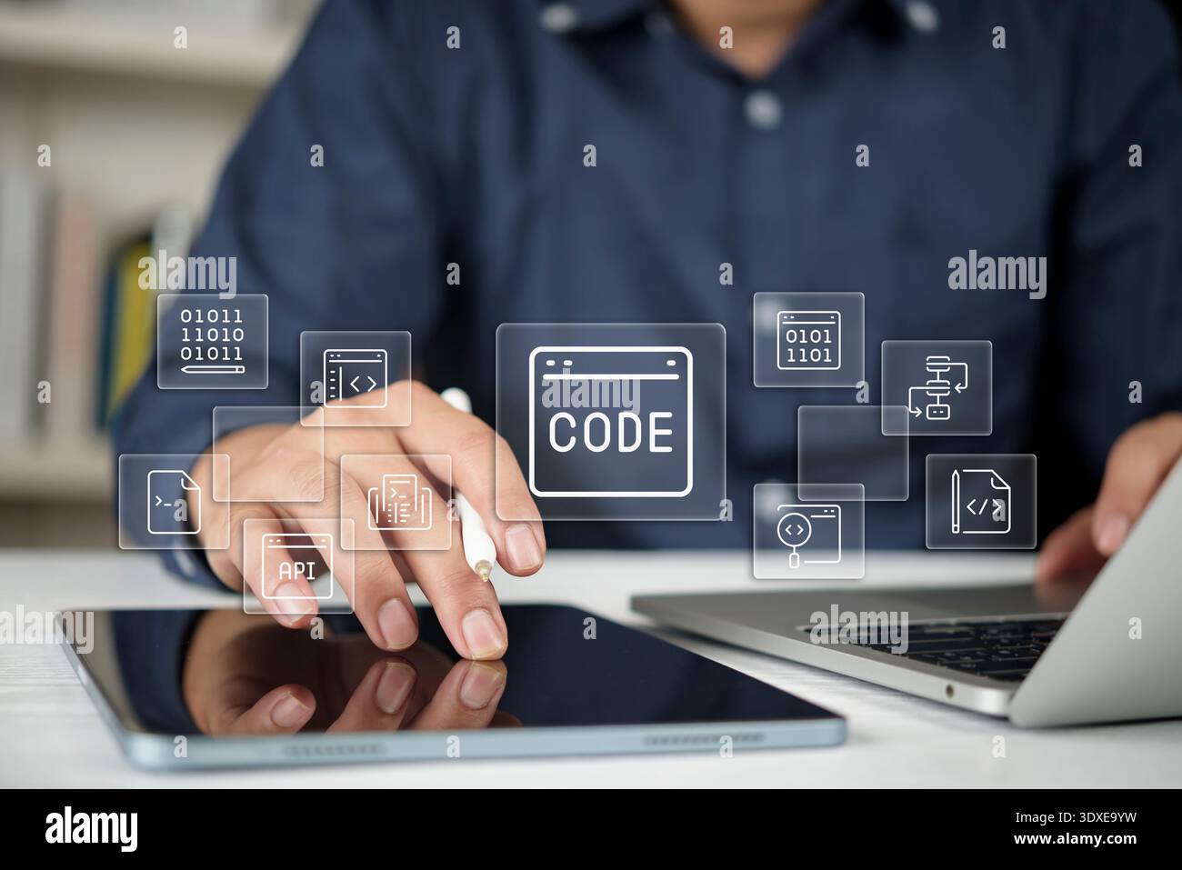 Programmer developer hands coding tablet laptop screen virtual icon api software web design technology html css binary data internet business applicat Stock Photo