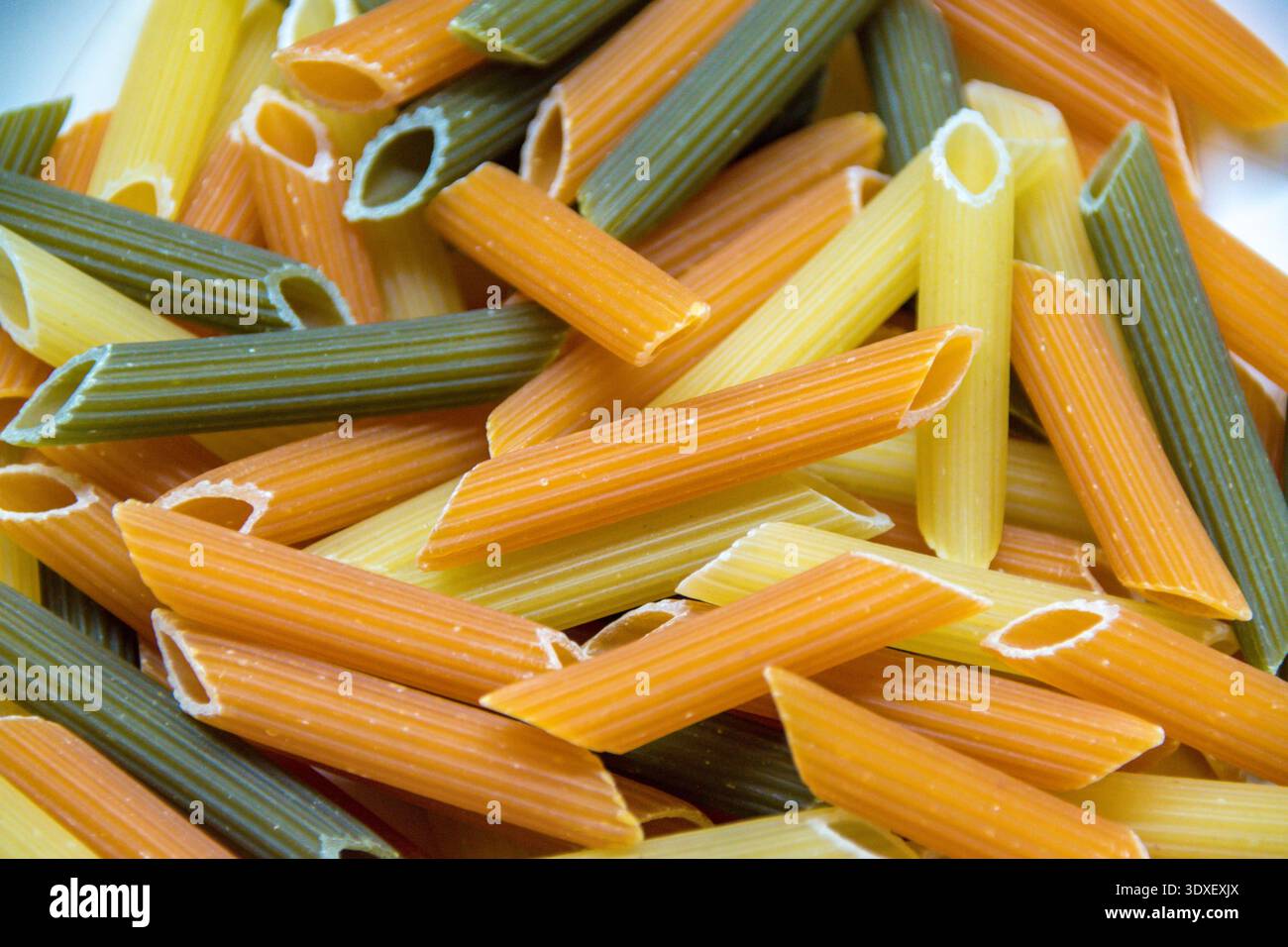 Tri color pasta noddles close up. Stock Photo