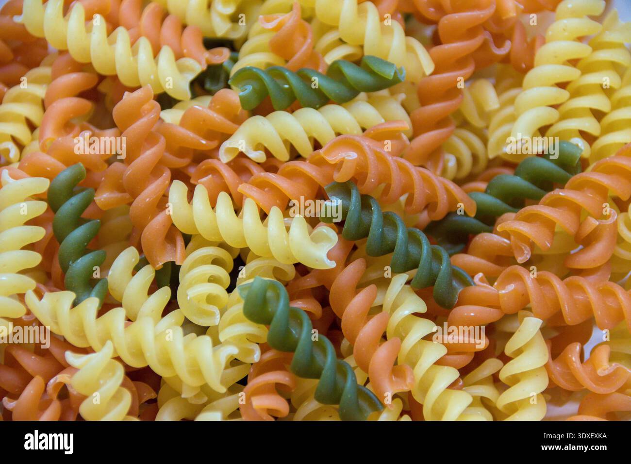 Tri color pasta noddles close up. Stock Photo