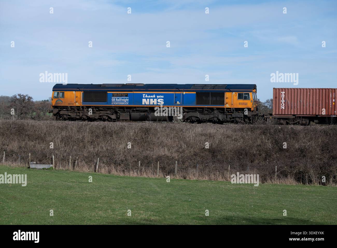 GBRf class 66 diesel locomotive No. 66731 "Capt. Tom Moore" pulling a freightliner train, Warwickshire, UK Stock Photo