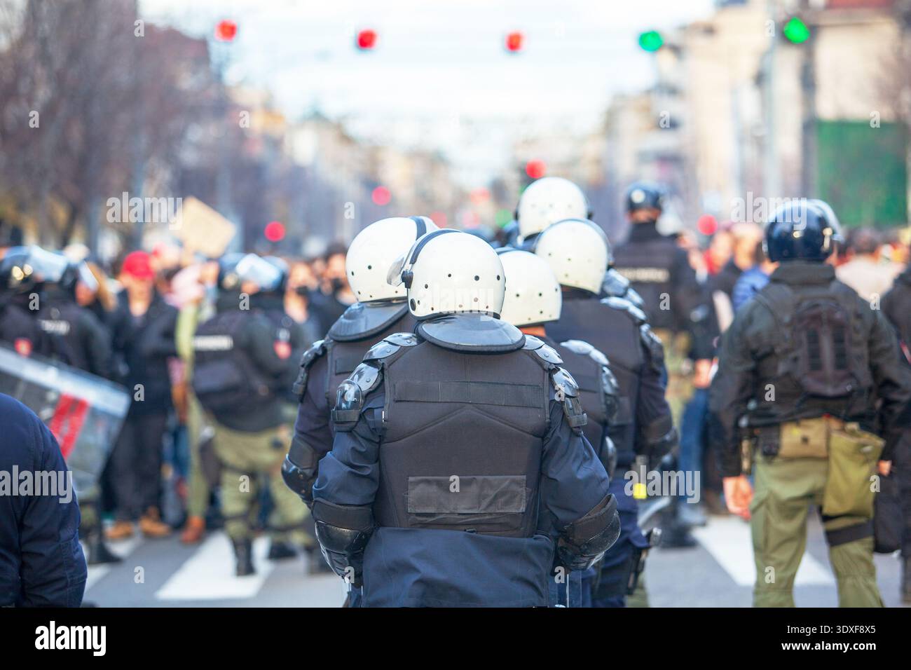 Riot police line in winter city street protest, crowd control and ...