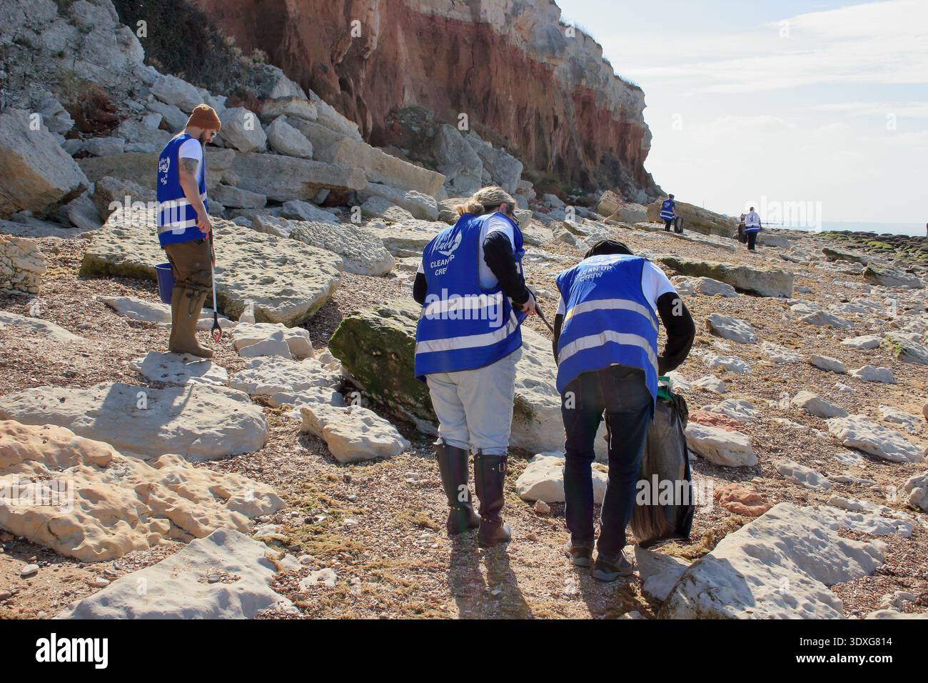 Litter picking on a beach. Litter pickers from UK charity, Life's a Beach at scenic Hunstanton beach on the North Norfolk coast, Britain, England, UK. Stock Photo