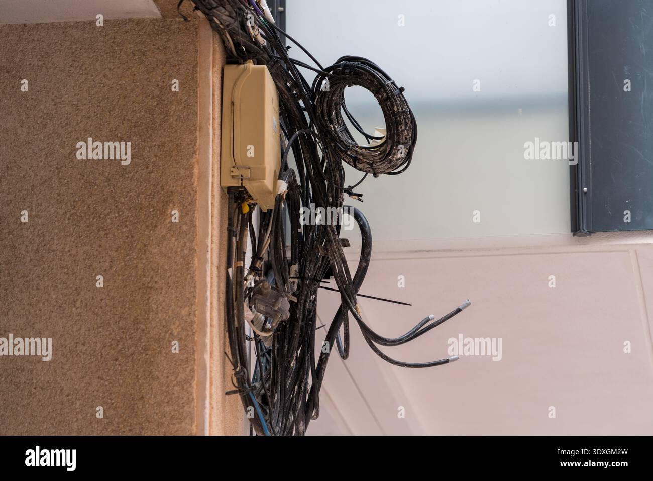 Cable Routing Messy Messy electrical cables installed on residential building Stock Photo ...