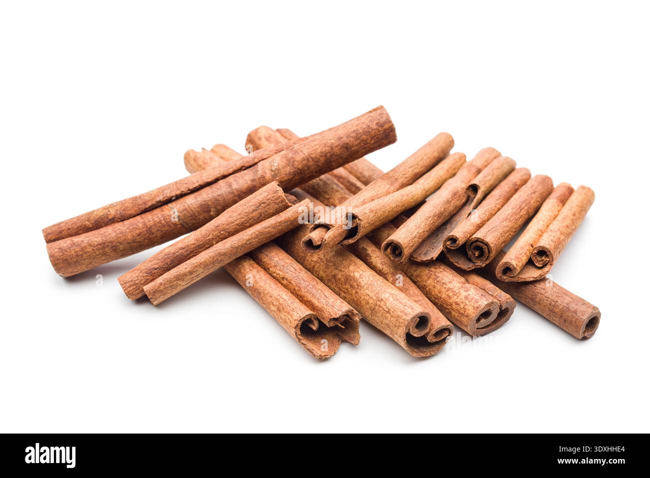 Cinnamon sticks pile on white background. Stock Photo