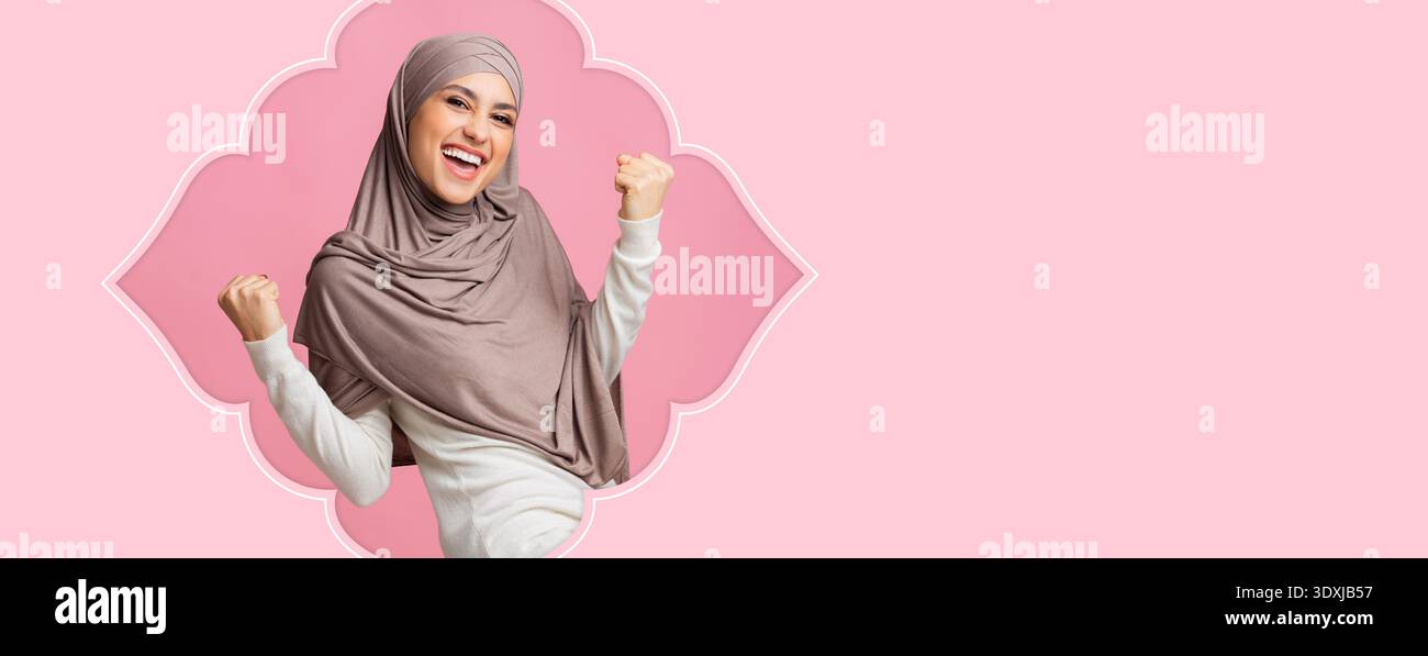Happy Woman Celebrating With Joyful Expression in Bright Colored Background Stock Photo