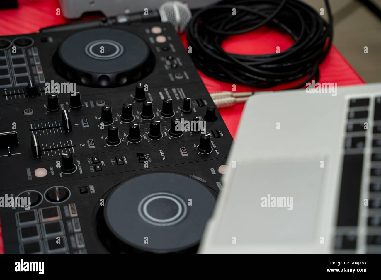 Close up of DJ controller and laptop setup. Stock Photo