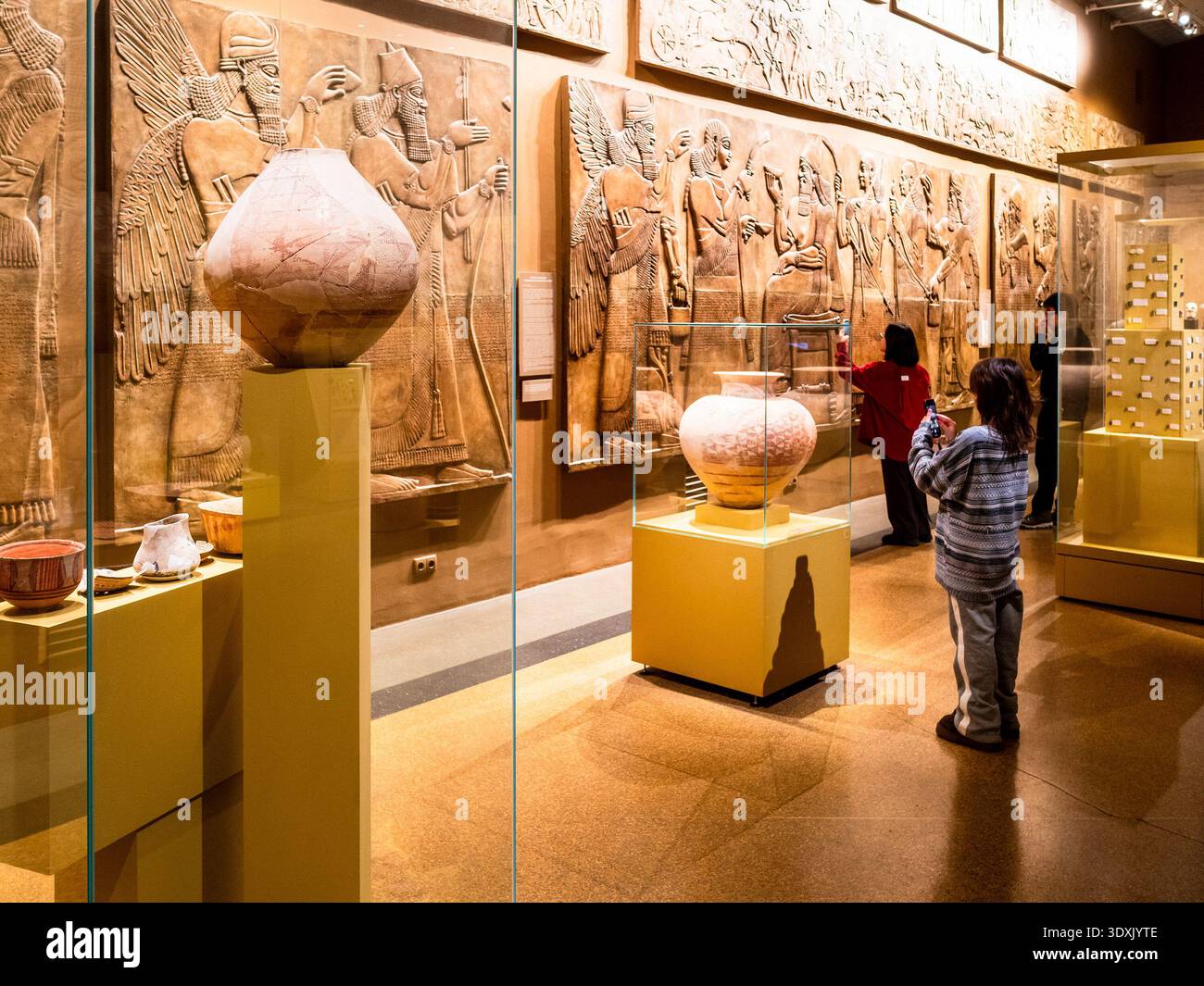 Moscow, Russia - January 11, 2026: visitors look at Assyrian relief in hall of Pushkin State Museum of Fine Arts, Moscow city Stock Photo
