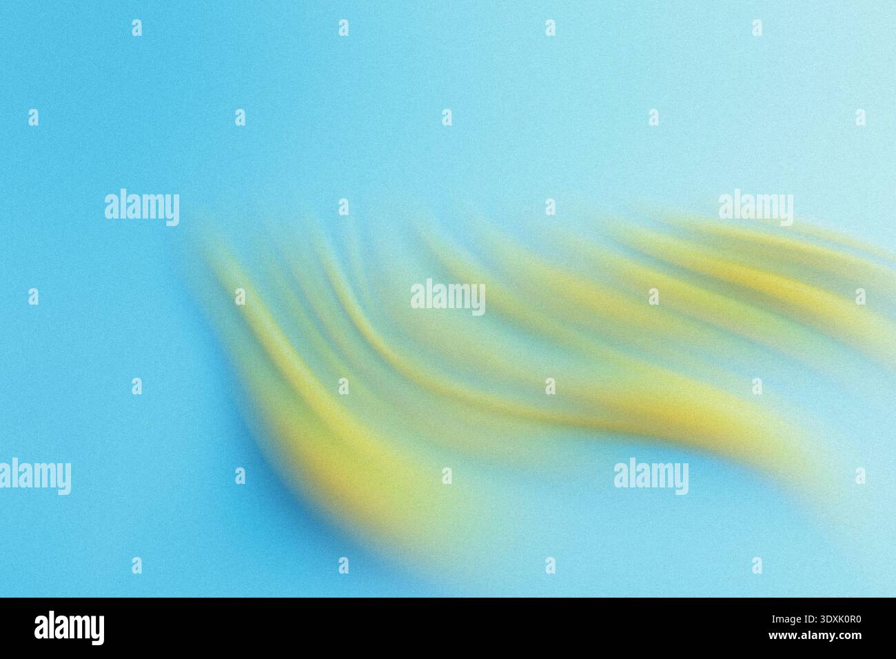 Abstract blurred background featuring a blend of yellow and blue colors creating a soft dreamy effect Stock Photo