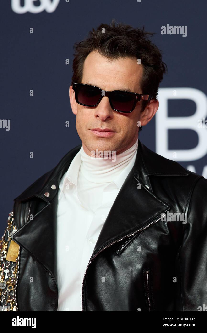 Mark Ronson poses for photographers upon arrivals during the Brit ...