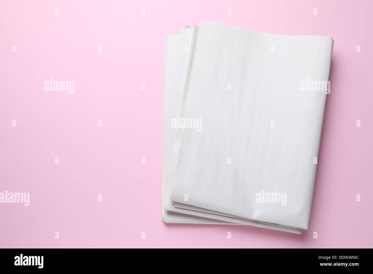 Newspapers on pink background, top view. Space for text Stock Photo