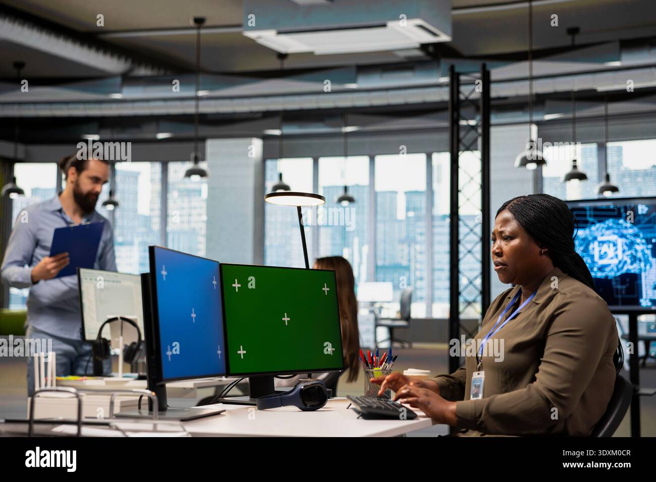 Admin using isolated screen computer at work to train machine learning models for anomaly detection automation. IT expert using AI on chroma key PC in office to repair network issues Stock Photo