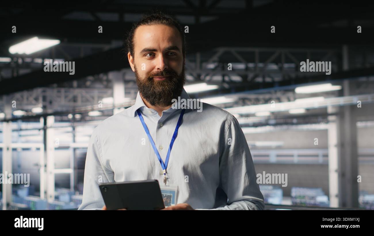 Portrait of smiling engineer in data center monitoring neural network LLM visualization. Cheerful server hub IT specialists overseeing rigs powering machine learning processes Stock Photo