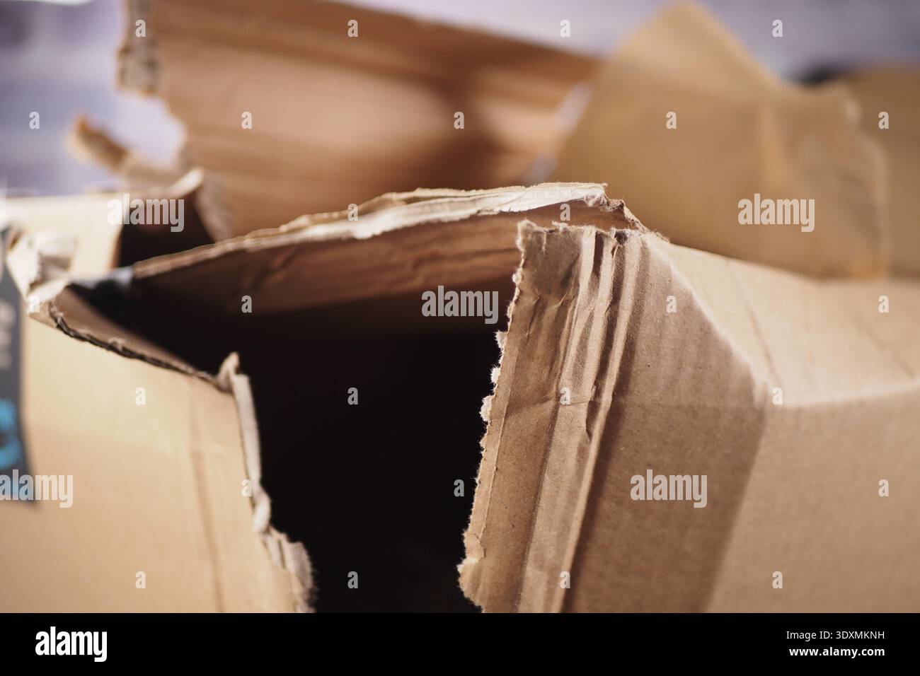 Cardboard box opened and damaged on a table Stock Photo