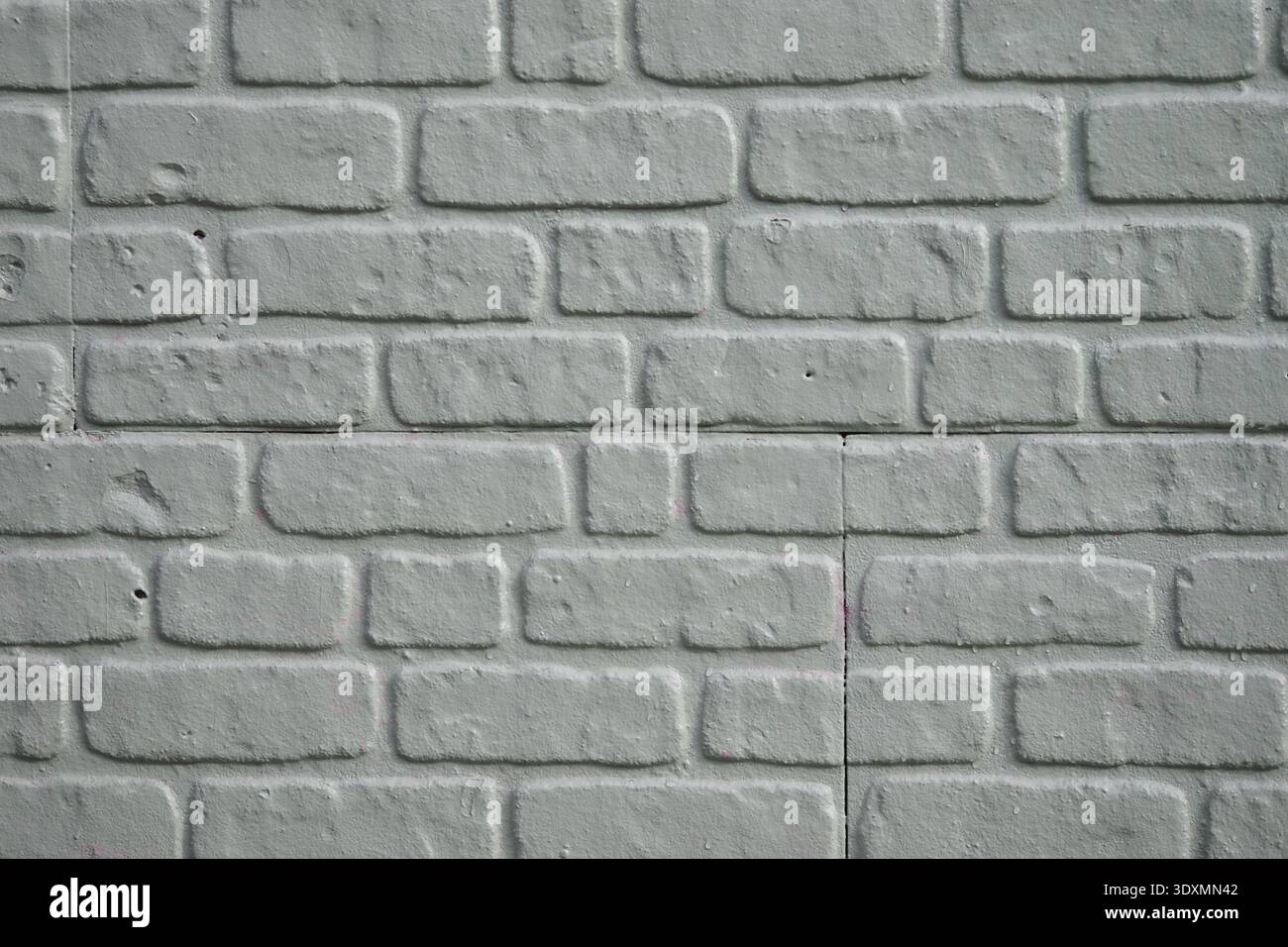 Textured white brick wall with a simple design Stock Photo