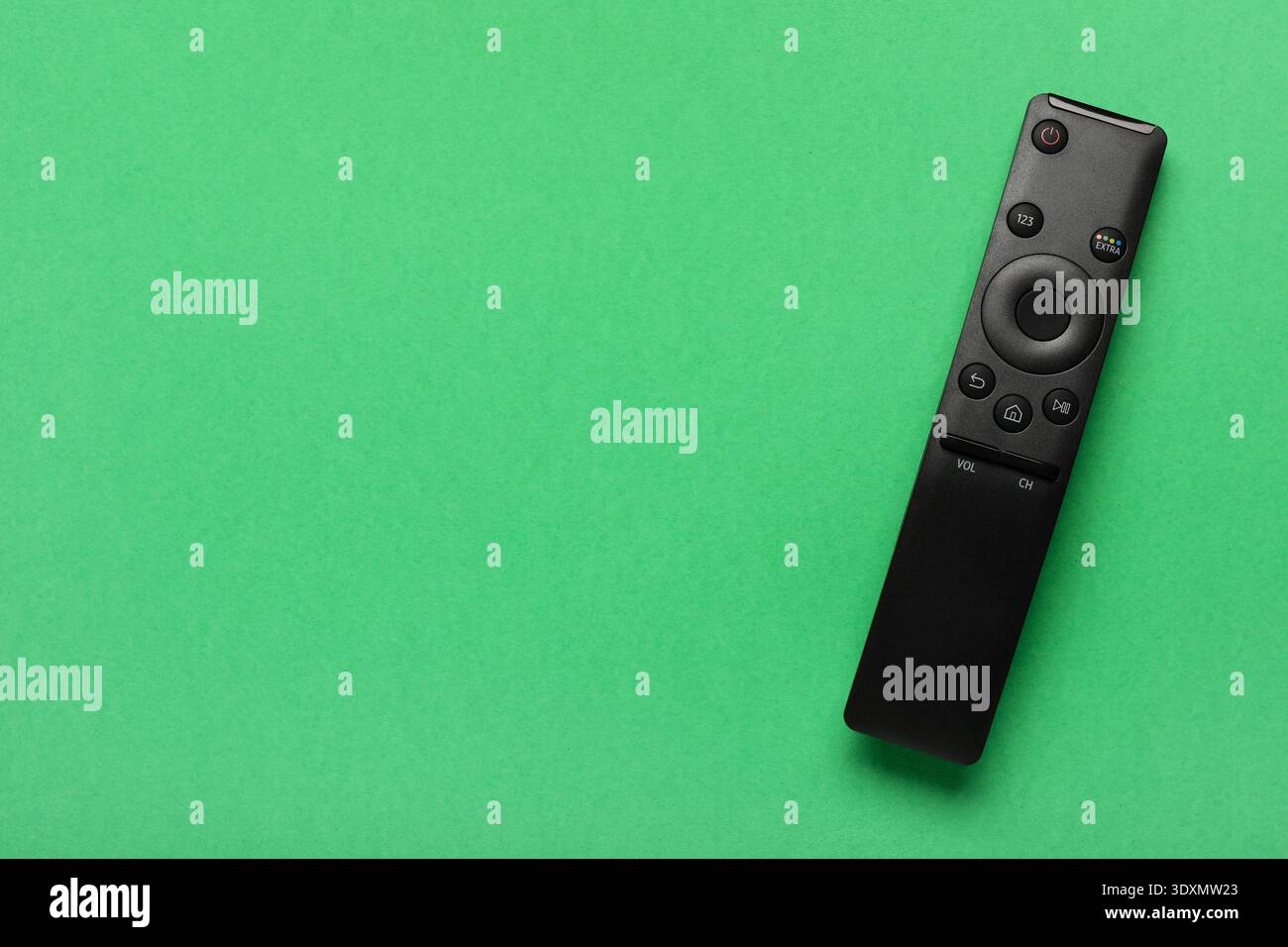 TV remote controller on green background Stock Photo