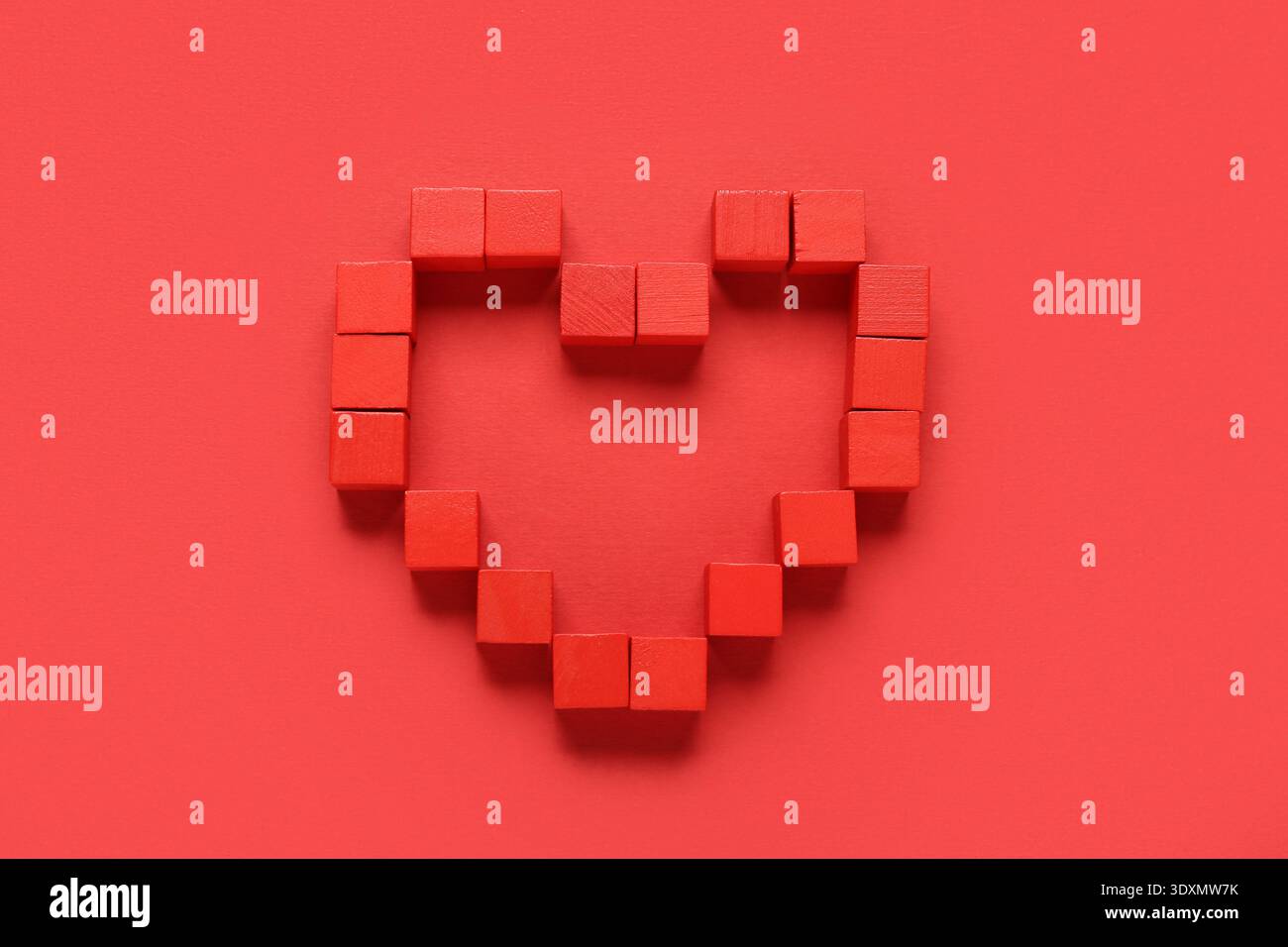 Heart made of cubes on red background Stock Photo