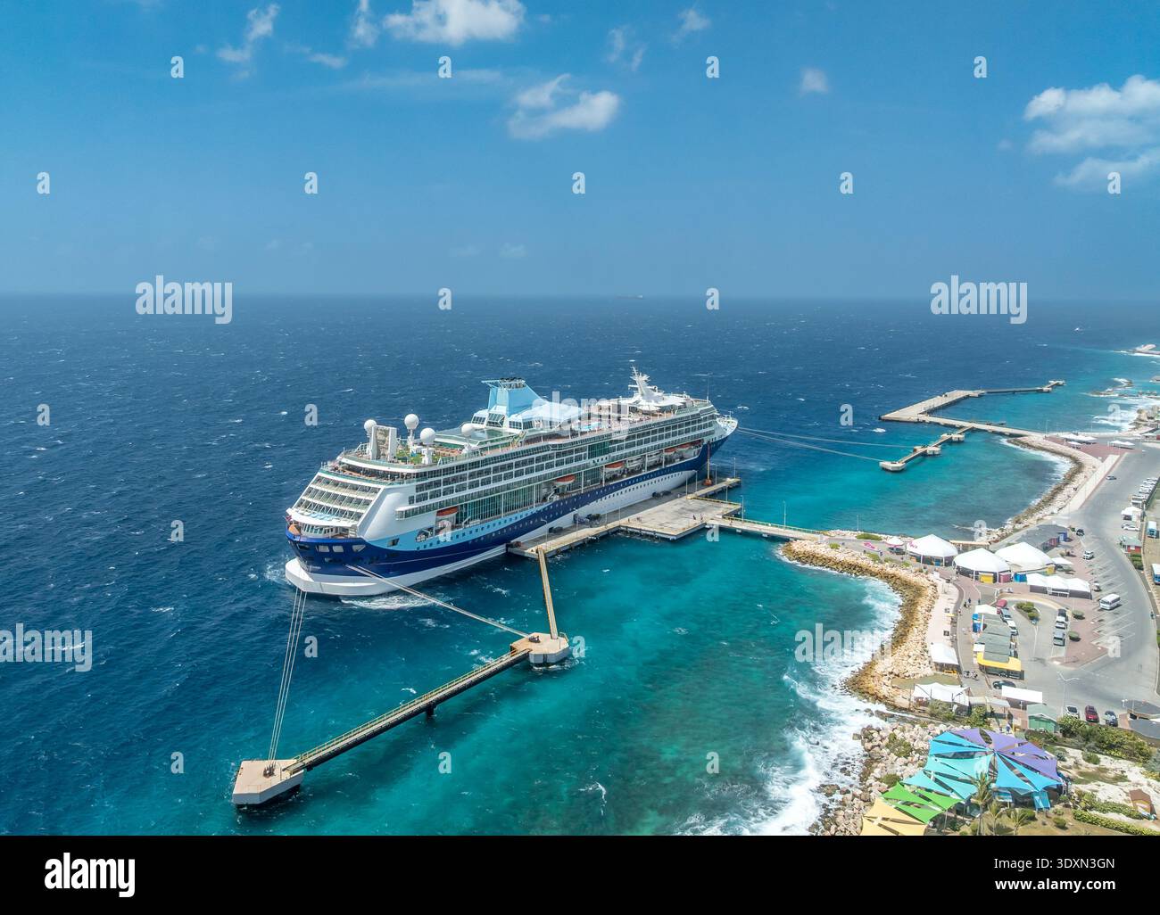 Adult only cruise docked in the Caribbean surrounded by Turquoise water Stock Photo