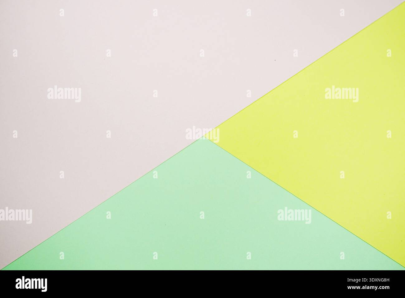 A minimal abstract image featuring intersecting geometric triangles in soft pastel color Stock Photo