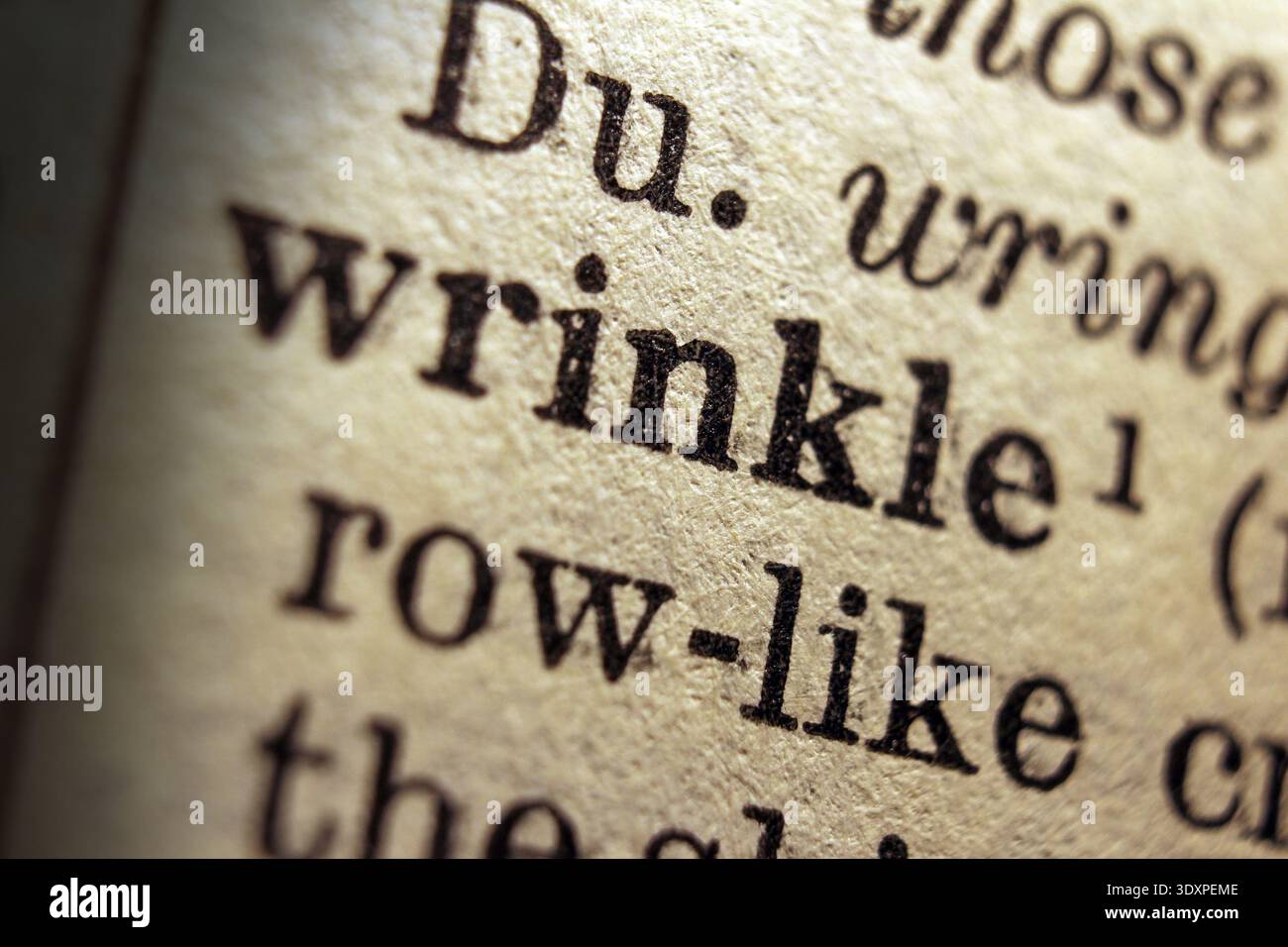 Word wrinkle printed on dictionary page, macro close up Stock Photo